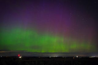 The Aurora Borealis — hues of green, pink and purple dance across the night sky