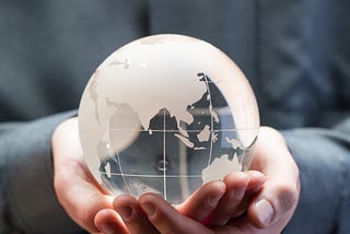 man holding globe