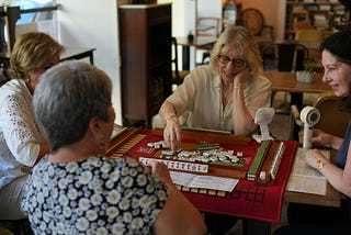 Four women playing Mahjong