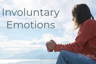 Photo of a woman sitting in front of a body of water, holding a coffee cup, with the words “Involuntary Emotions”