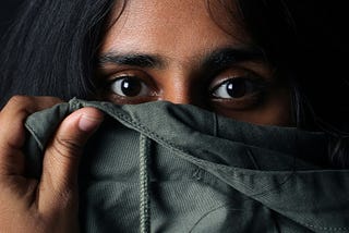 woman covering part of her face