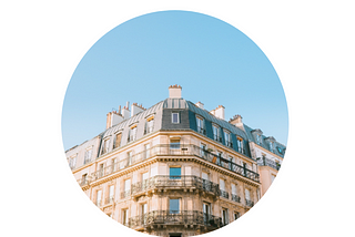 An image of a Paris apartment with blue sky above.