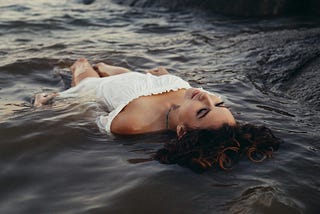 Woman floating effortlessly in the water
