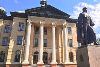 The Fort Bend County Clerk Building in Richmond Texas. Constructed in the early 1900s. The statue is of Mirabeau B. Lamar.