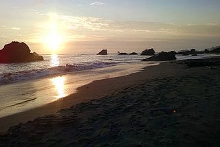 Color photo of Harris Beach, Oregon at sunset taken by author Stella Martann