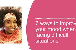 Black woman with curly hair is smiling. She’s wearing a sweater and matching headband.