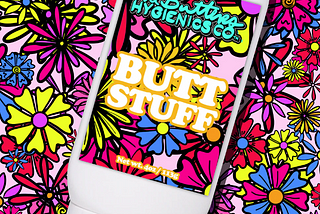 Bottle of lube with bright flower covered background. Label reads “The Butters Hygienics Co. Butt Stuff”