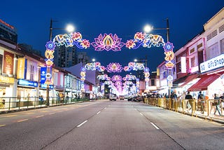 Colorful lights above the streets and shophouses building on both side in Little India by night.