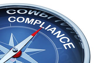 A navigational compass points toward the word “compliance.”