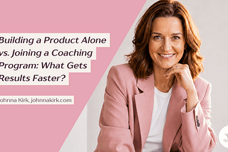 Blog header graphic with a soft blush-pink geometric background on the left and a bright professional portrait on the right. The headline reads: “Building a Product Alone vs. Joining a Coaching Program: What Gets Results Faster?” Beneath the title is the byline: “Johnna Kirk, johnnakirk.com.” On the right, a smiling woman with shoulder-length brown hair wears a blush-pink blazer over a white top, resting her chin on her hand. The image features a clean, modern aesthetic with soft lighting