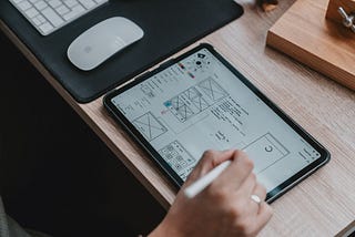 UX designer working on wireframe on tablet