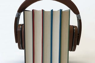 Headphones + books | Photo by sindrehsoereide from Pixabay