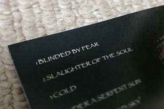 CD booklet featuring the song title ‘Blinded by Fear’