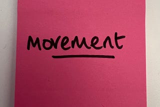 image of a pink post it note saying movement