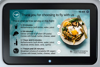 LCD monitor in the back of an airplane seat, displaying the menu for that particular flight