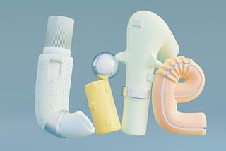 Pastel coloured medical devices and tubing spelling out the word, @life”