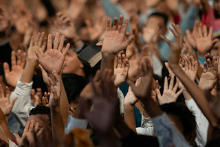 raised palms in applauding crowd of people