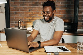 Black man using a laptop