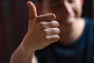 Guy with his thumbs up