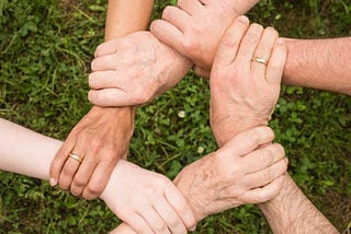 A family holding hands together