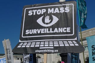 A laptop with the screen saying Stop Mass Surveillance