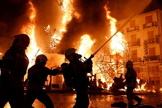 Firemen putting out the flames during the celebration