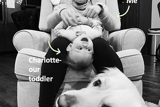An image of Megan Nufer, her toddler-Charlotte, her golden retriever, sitting on a chair in her Chicago apartment.