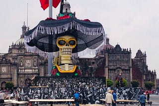 A giant skeleton wearing a hat is at the centre of this picture, representing the “Day of the Dead” in Mexico City