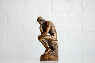Figure 1: Small version of The Thinker statue (Unsplash, 2021).