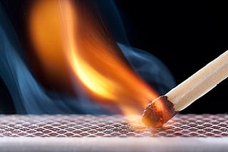 A match sparking alight.