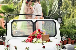 A couple having special moment on a classic white vintage car