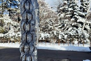 Ice pillars form on a drainage chain over two days of heavy snowfall in Nagano