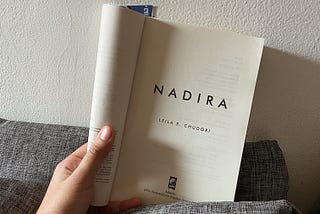 A hand holding book entitled Nadira written by Leila S. Chudori