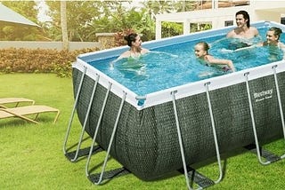 family enjoying in above ground pool