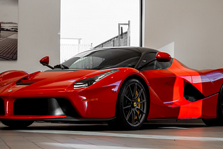 Red Ferrari in a luxury home garage