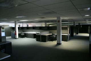 An abandoned  office building with empty desks