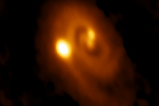 An ALMA millimeter wave telescope image of the formation of three protostars over a field of about 100 times the Earth-Sun distance.