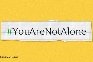 A piece of paper ripped from a noteback with the hashtag ‘YouAreNotAlone’.
