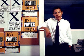 Former U.S. President Barack Obama posing with voter registration flyers in the 1980s as a community organizer in Chicago, IL.