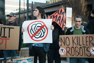 a man holding an openai logo crossed out in a protest