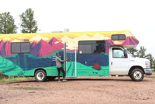 A picture of me standing in front of my RV in Pikes National Forest
