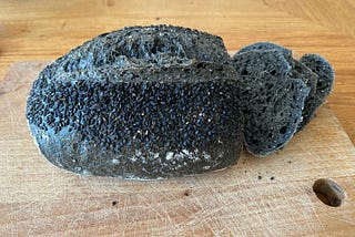 Black bread with black sesame seeds on top.