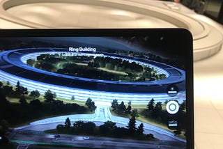 A tablet showing an Augmented Reality version of the Apple’s Headquarters.