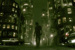 The silhouette of a young man is seen approaching the viewer. He’s holding a katana. A greenish city surrounds him.