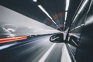 image showing a car in dark tunnel