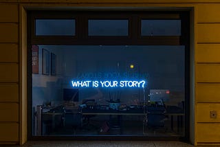 Illuminated sign ‘What is your story’