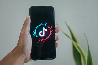 A picture of a phone showing the TikTok application