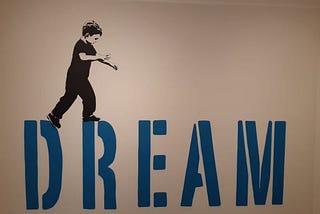 Young boy walking on the Letters DREAM