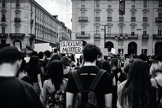 a photo of protestors walking the streets from the black lives matter protest