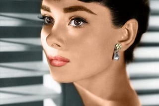 Audrey Hepburn wearing retro era jewelry